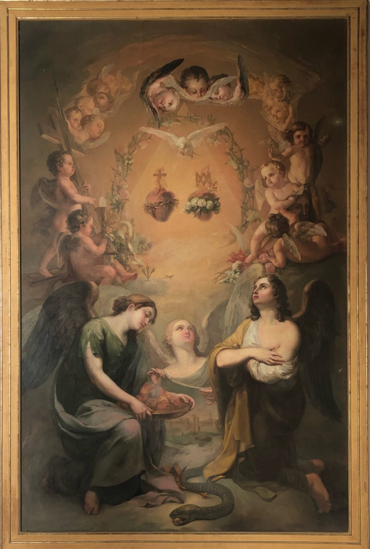 The Education of the Virgin, Vicente López Portaña A painting by Vicente López Portaña of two hearts suspended above angels kneeling in adoration, while other angels look on from above and each side. The heart on the left is surrounded by thorns with a cross above it, the heart on the left is surrounded by white roses with stylized crown in the shape of the letter 'M' above it.