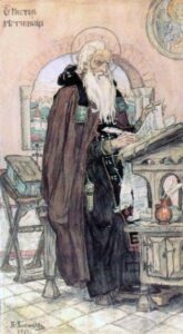 A photograph of an image of Nestor the Chronicler by Viktor Vasnetsov. Saint Nestor sits before a desk writing, robed in ornated garb with an open window behind him.