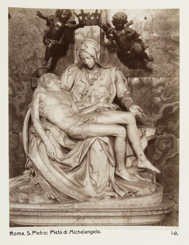 Photo of Michaelangelo's Pieta in Rome (Pietà_-_Hallwylska_museet_-_107520.tif) A photo of Michaelangelo's Pieta statue in Rome. Mary sits with the dead body of Jesus across her lap, looking mournfully down at Him.